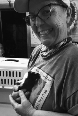 Donna holds a skunk